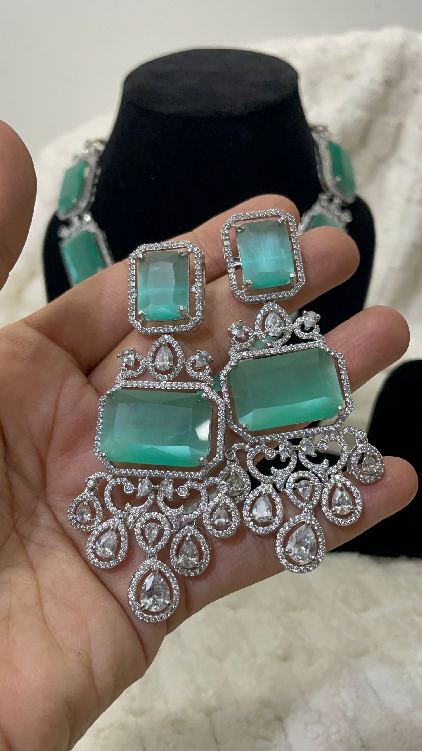 Emerald green american diamond necklace set with silver toned accent