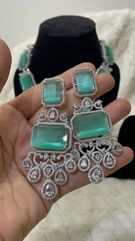 Emerald green american diamond necklace set with silver toned accent